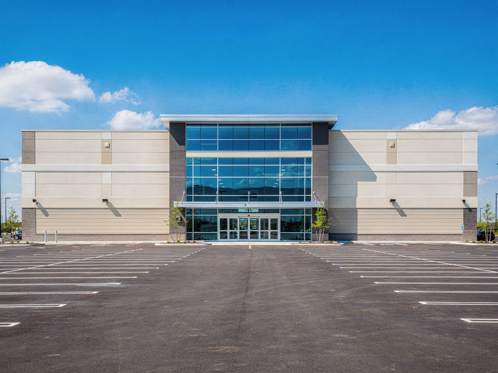 A large modern big-box retail store exterior on a bright clear day