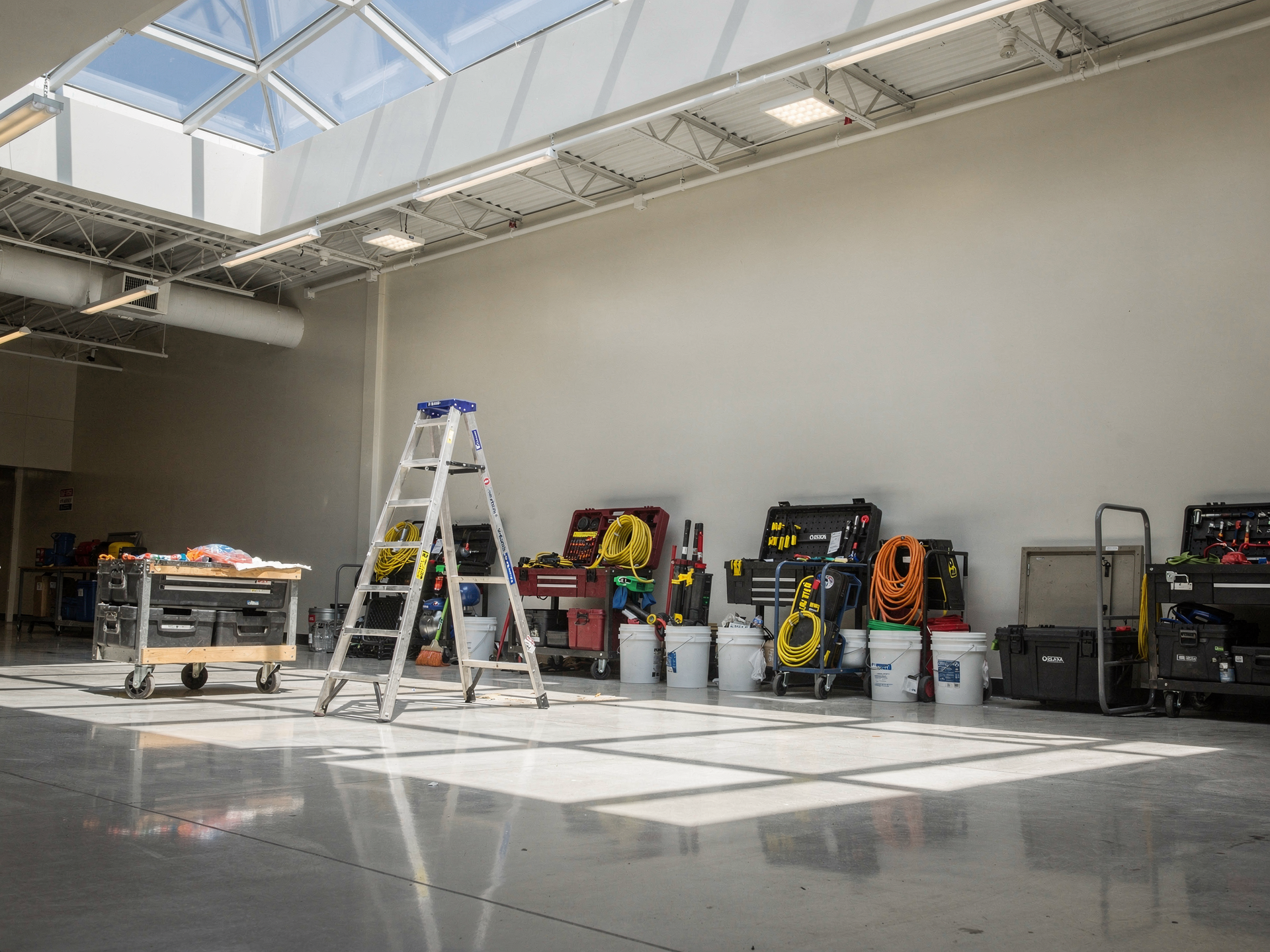 A bright, tidy retail interior under maintenance with neatly staged tools